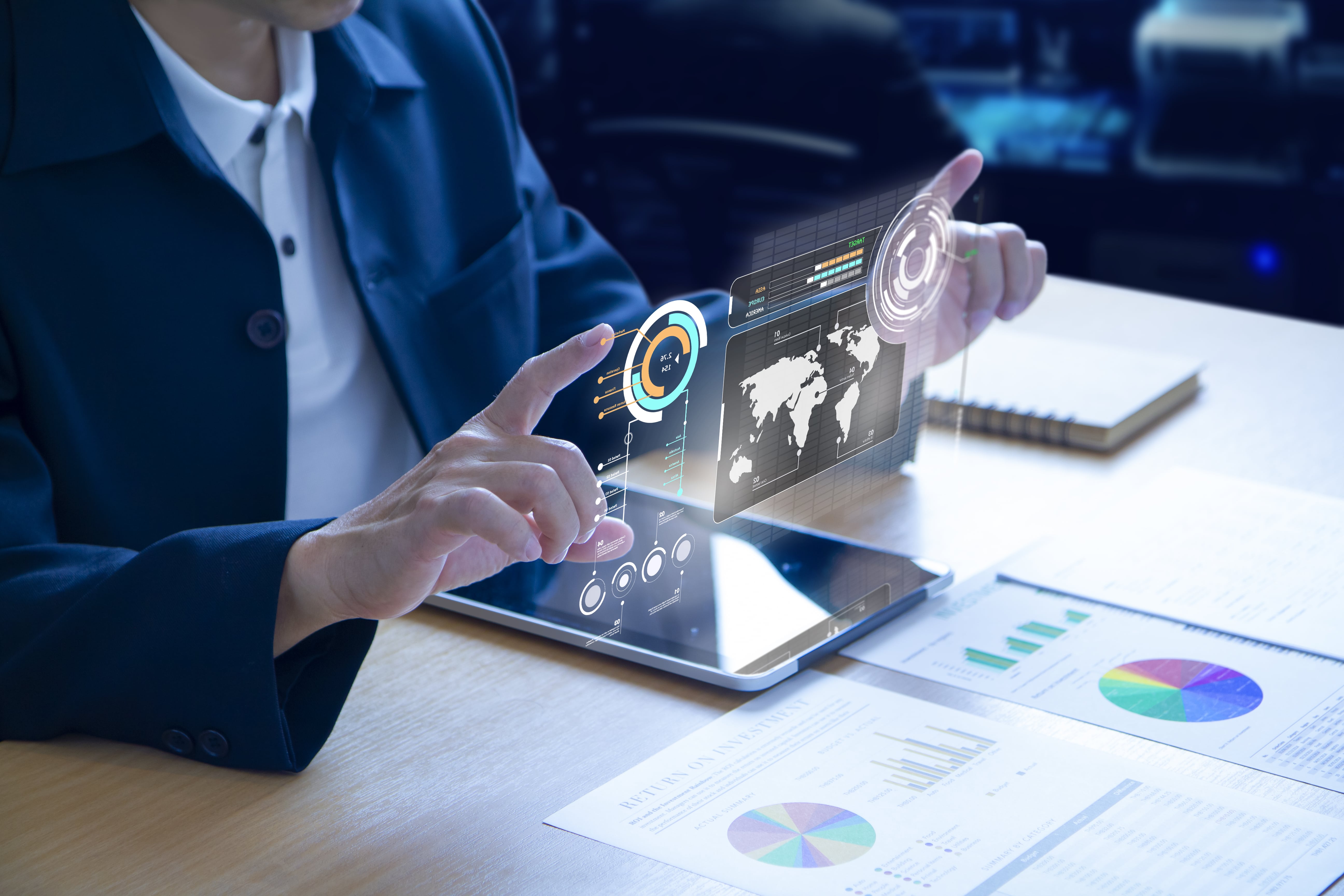 business-man-expanding-futuristic-virtual-screen-modern-tablet-min